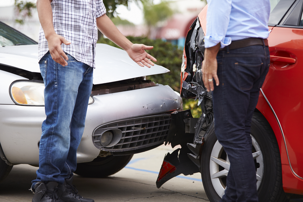 two drivers talk after traffic accident