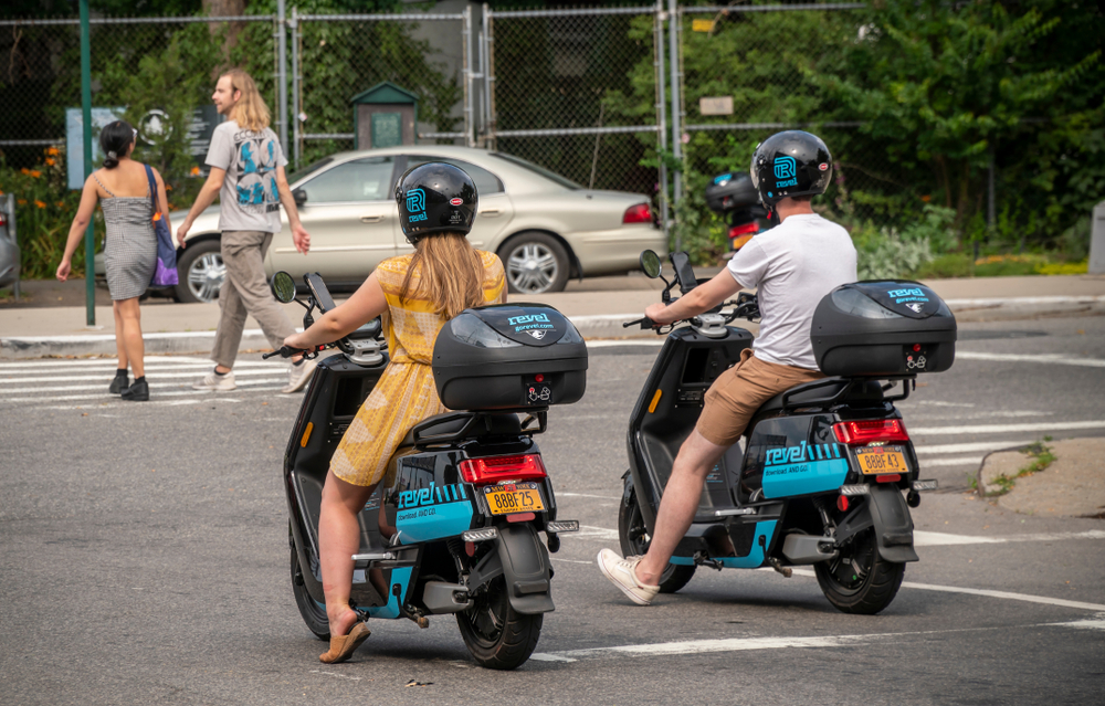 electric mopeds driving around city