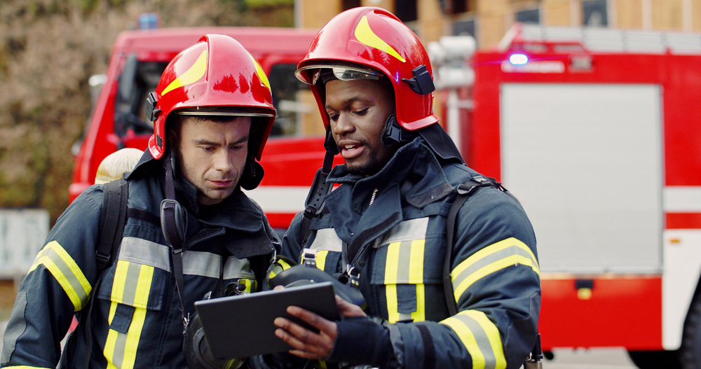 two firefighters working together