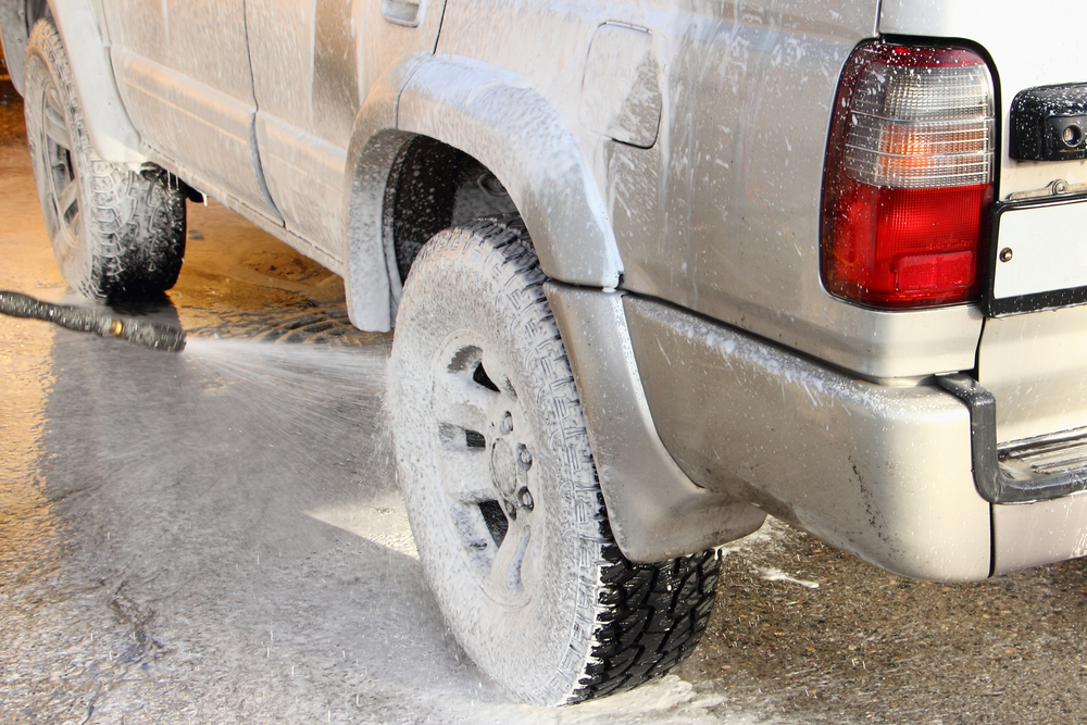 soapy wheel being pressure washed