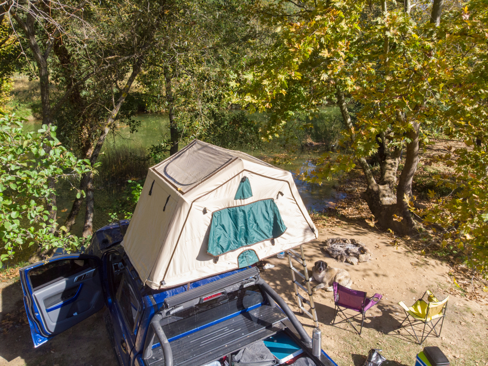 A soft shell roof top tent on an SUV