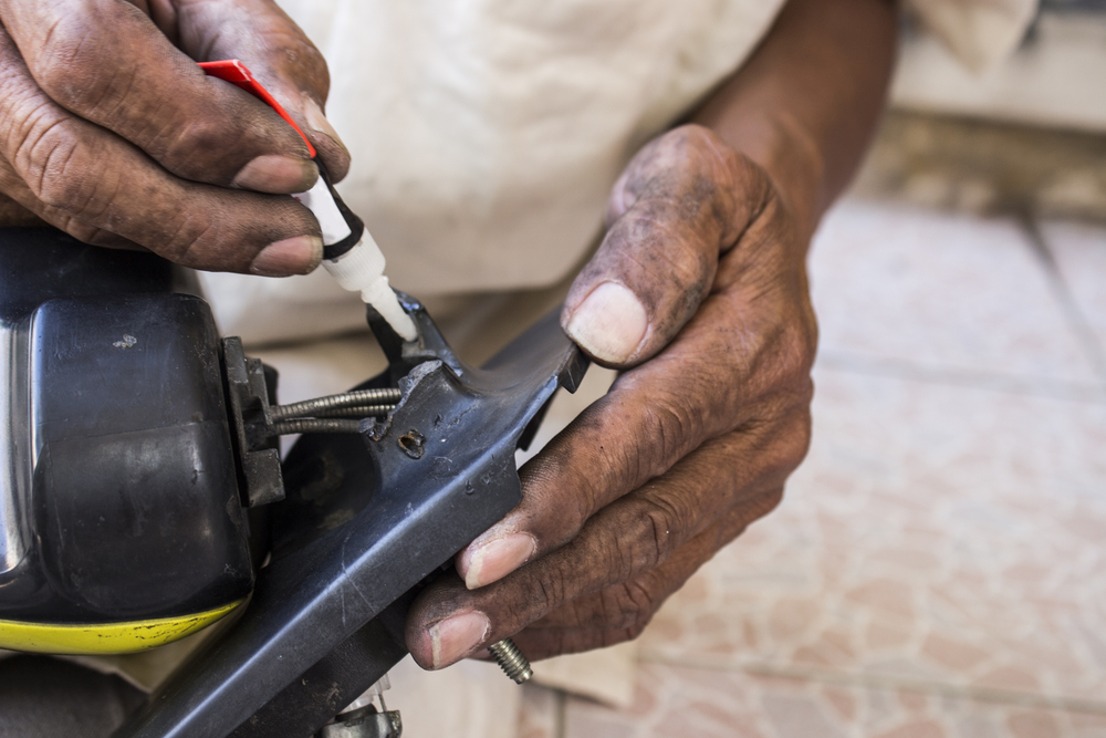 hands gluing car