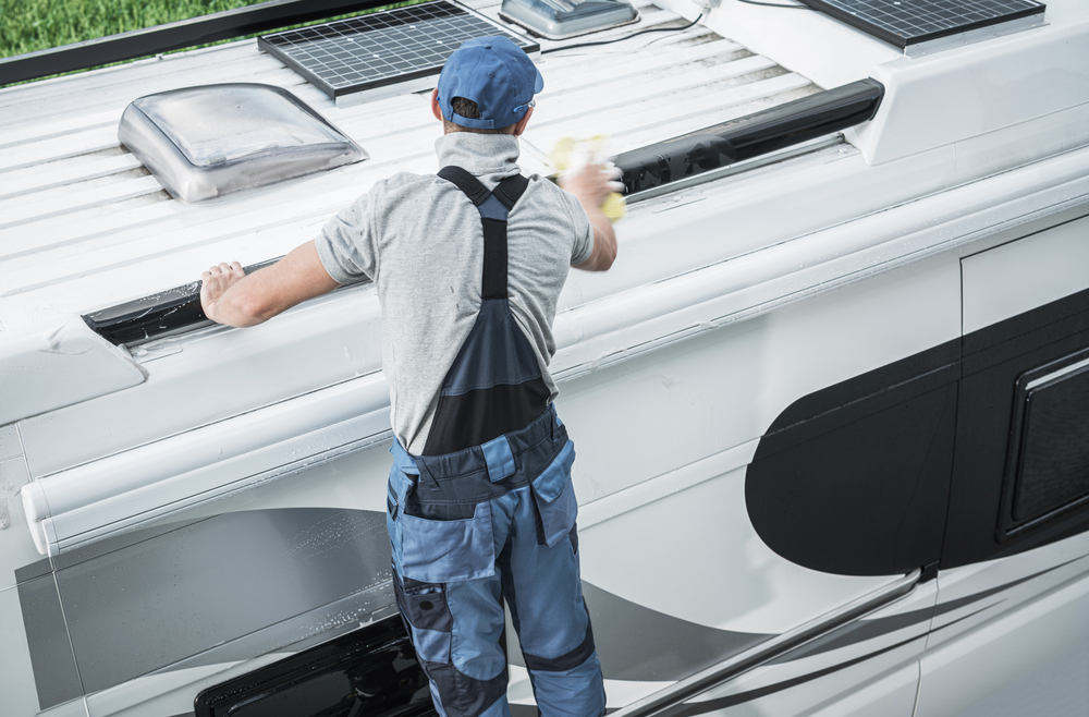 A man cleaning his RV roof