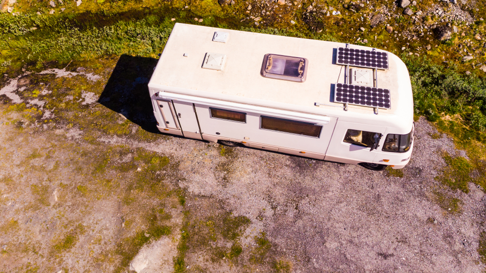 solar panels installed on the roof of an old RV