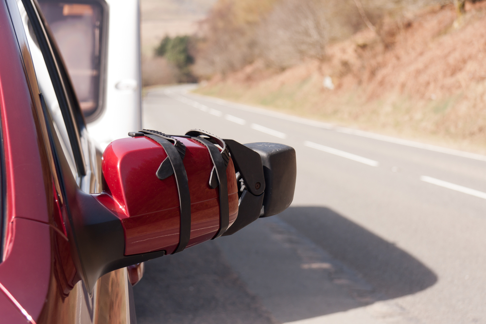 A clip on style mirror with friction straps