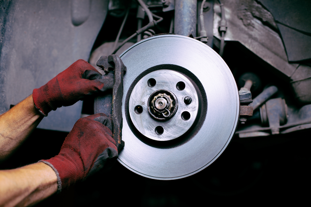  man changing brake pads