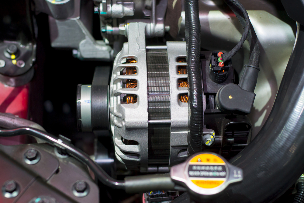 a car’s starter motor under the hood