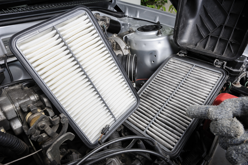 a clean air filter next to a dirty air filter