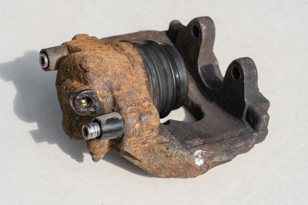 dirty brake caliper with the piston fully extended