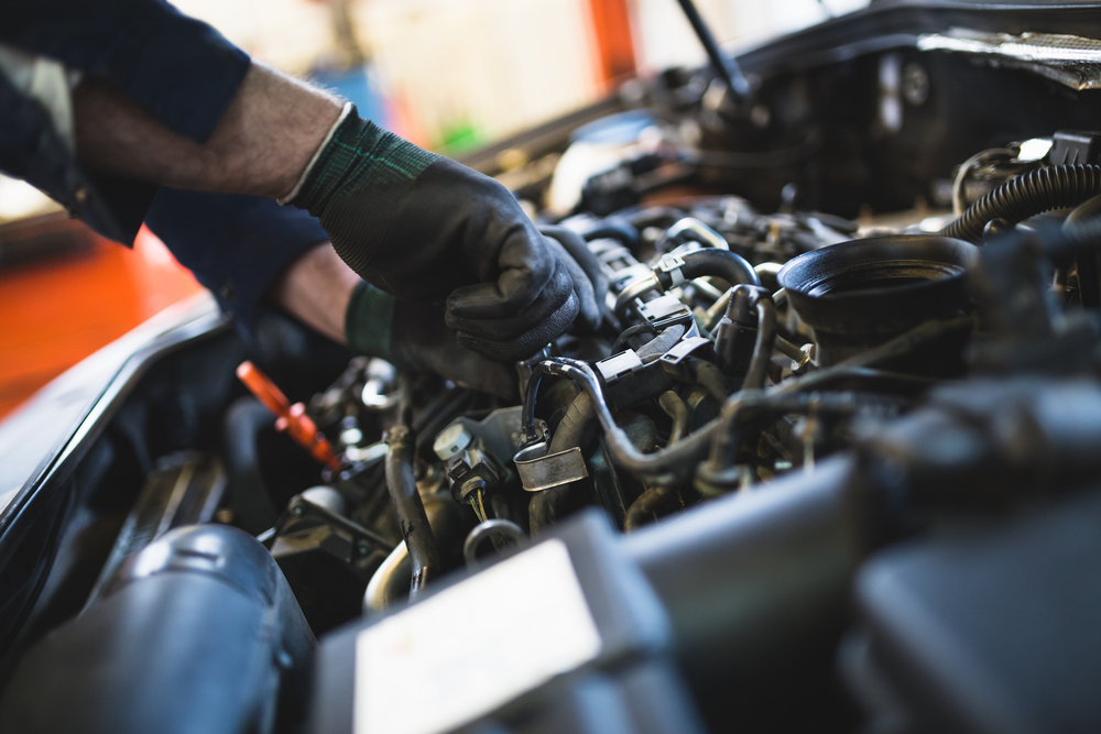 mechanic doing car maintenance