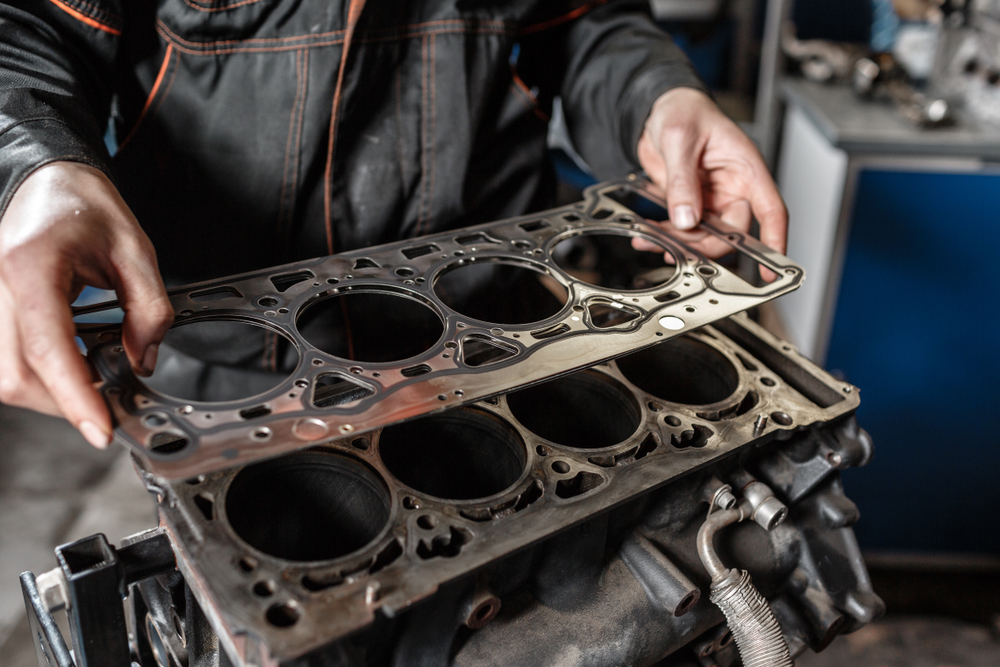 mechanic replacing a head gasket