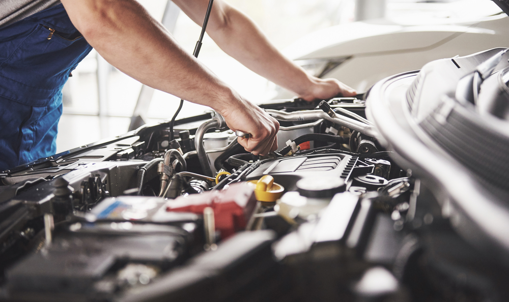 mechanic working on car