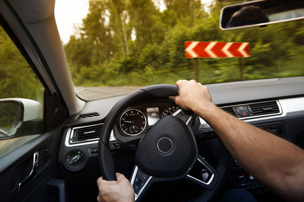 driver turns steering wheel