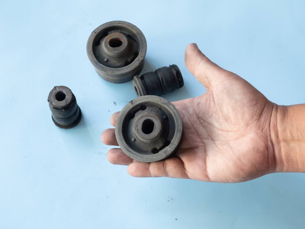 car bushings being held individually