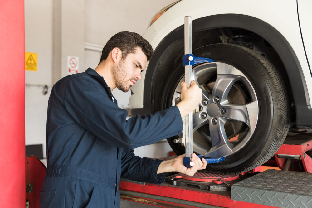 mechanic adjusting camber