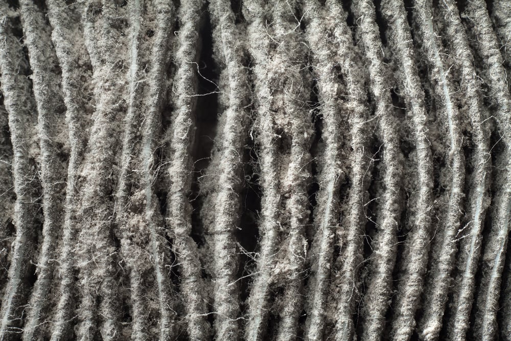 up close view of a heavily dirty air filter