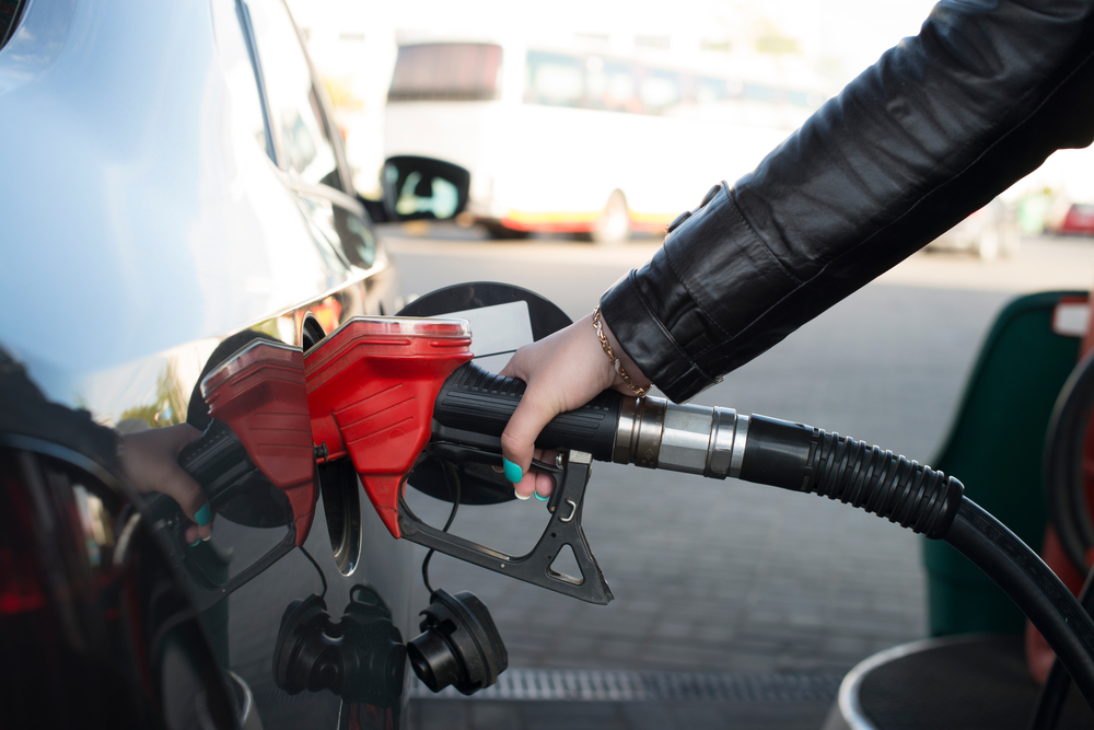 woman refueling car