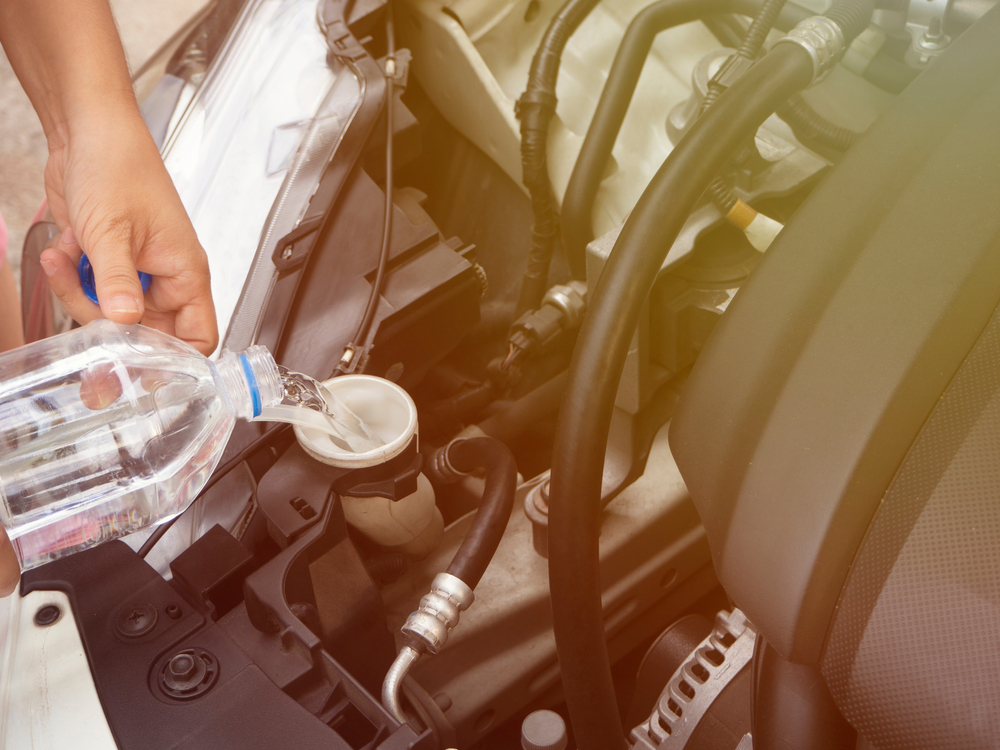 filling a radiator tank with water