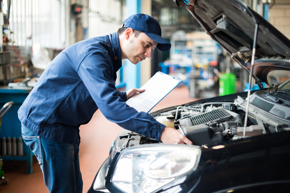 a mechanic inspecting a car engine